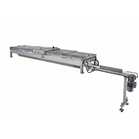 Automatic charging of dough pieces on swing tray proofer or belt proofer with glimek V-belt charging system.
